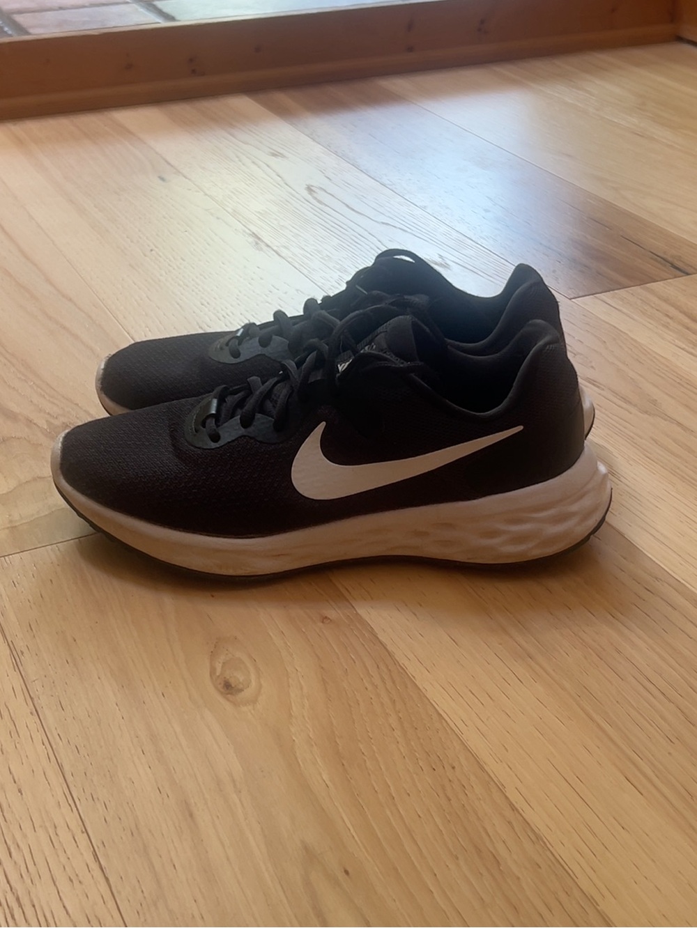 Nike Black Athletic Running Sneakers with White Swoosh